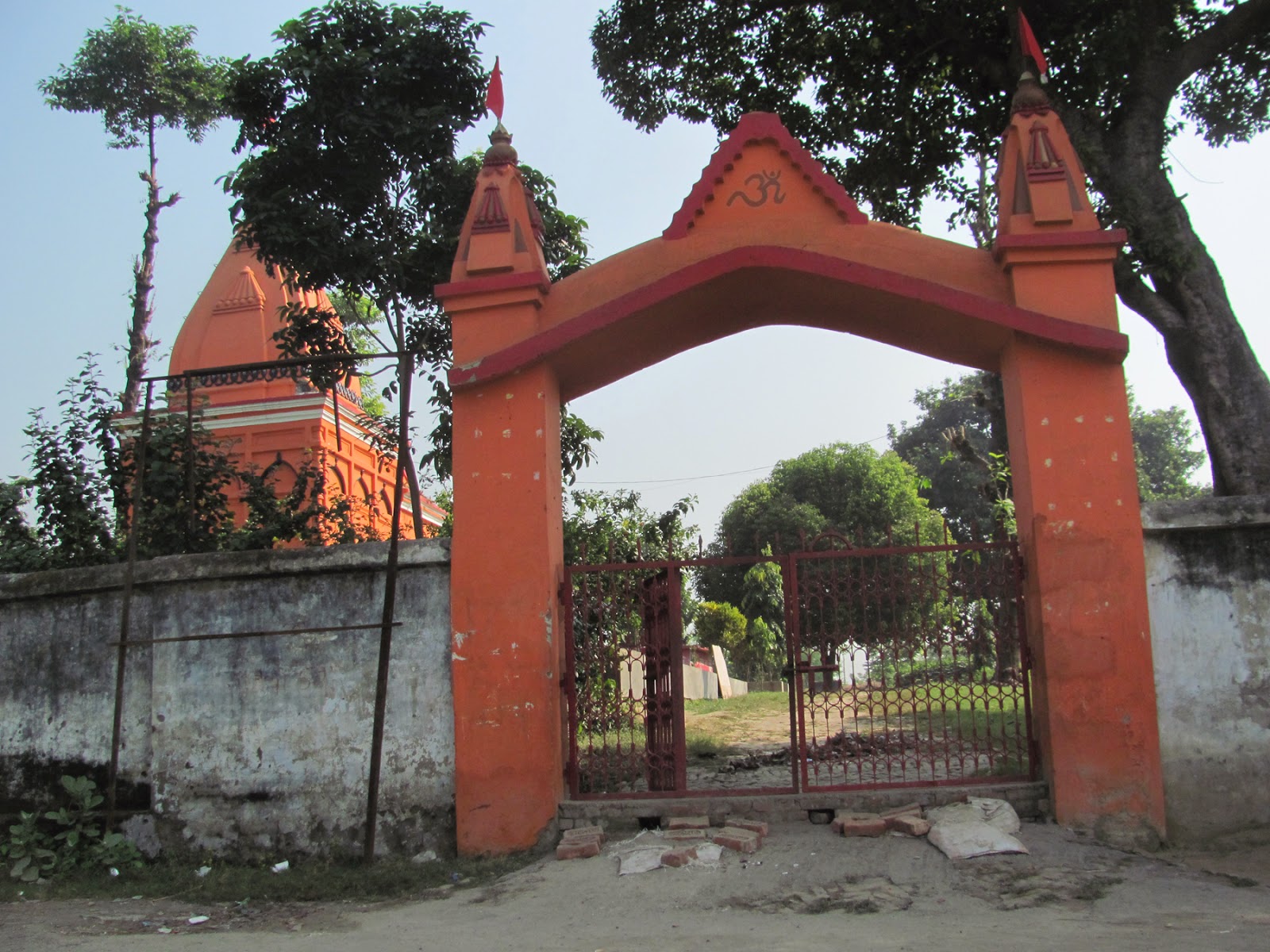 Temple gateway and courtyard framed by trees